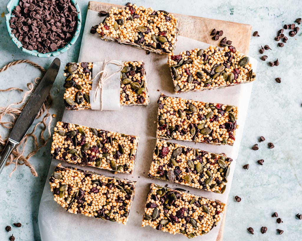 Top view of homemade granola bars with seeds and chocolate chips.